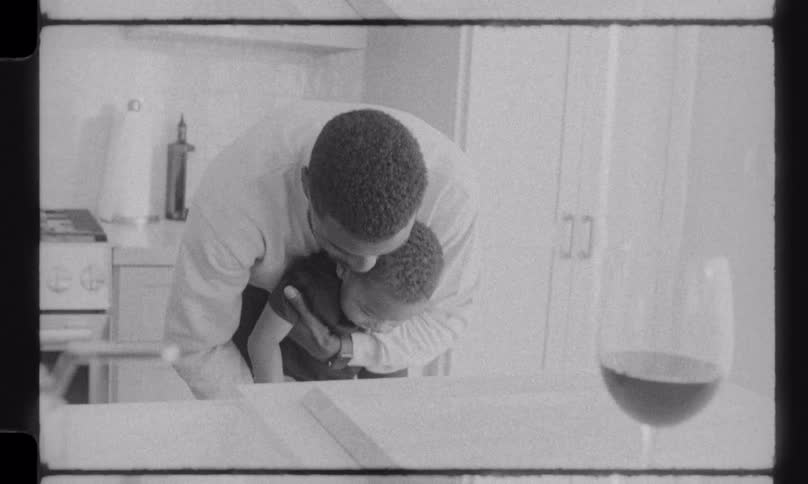 A heartwarming black and white vintage-style montage of a family enjoying daily activities together in their kitchen