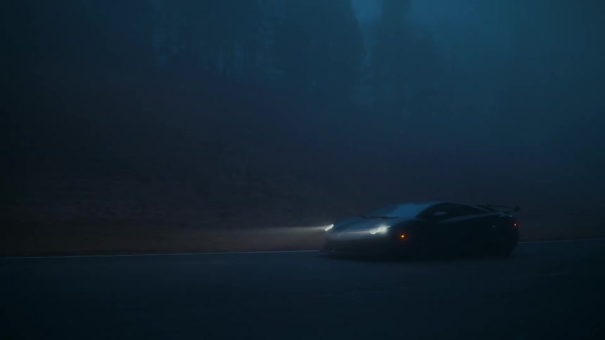 A sleek sports car with bright headlights on slowly navigates a corner on a winding road through thick, mysterious blue fog at night