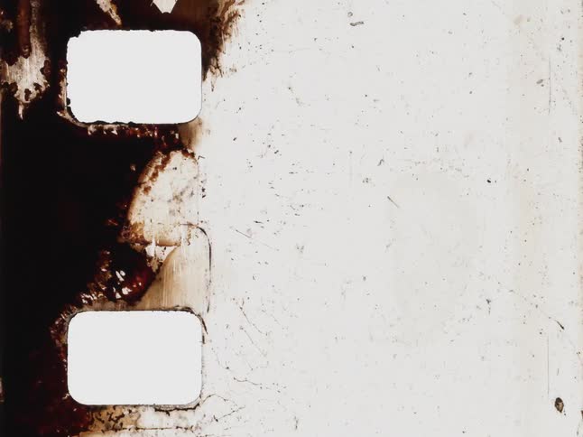 An abstract, grungy animation showcases the unique textures of burning and decaying vintage film strips