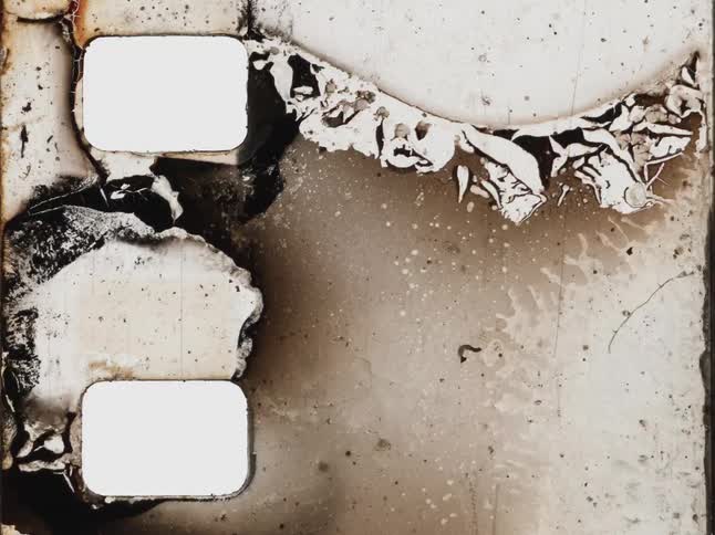 Abstract stop-motion animation of a distressed and decaying vintage film strip