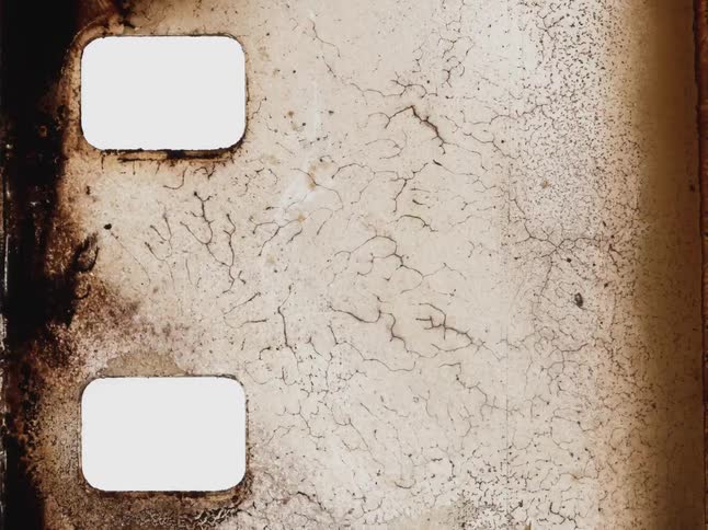 A stop-motion animation of an old, damaged film strip with abstract decaying patterns and textures