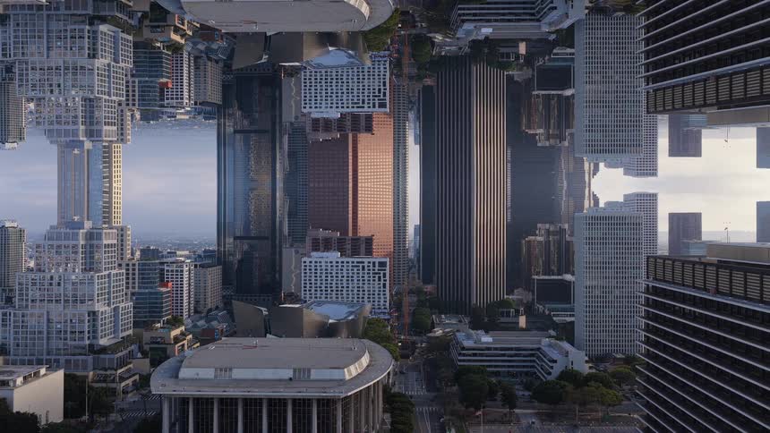 A surreal, vertically mirrored timelapse of a downtown cityscape captures the shifting light and shadows across the skyscrapers