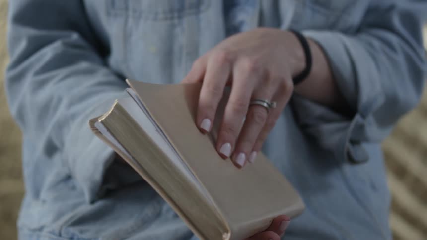A person opens up her notebook