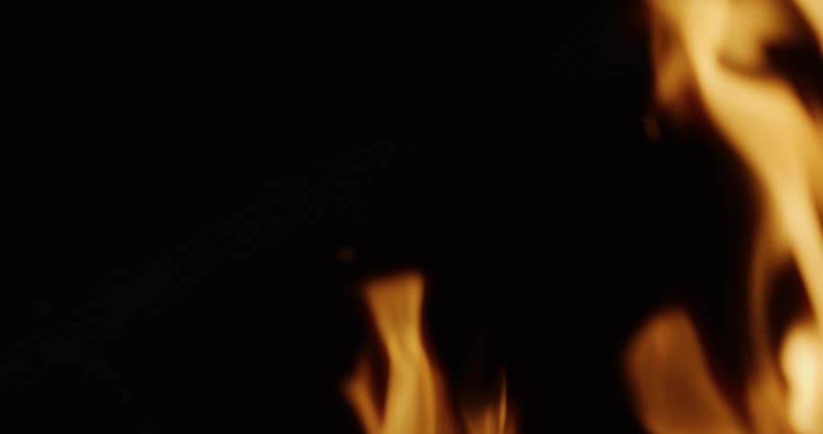 A mesmerizing close-up of fire burning in slow motion against a dark background
