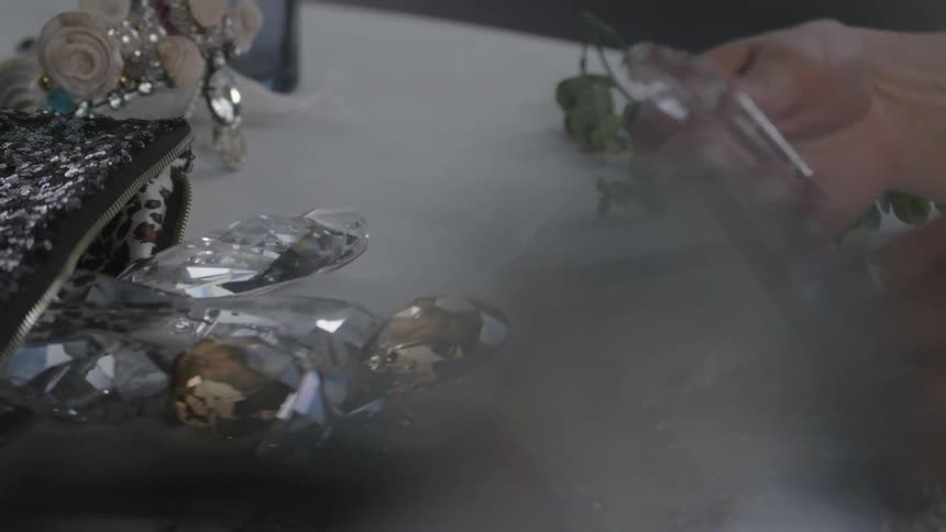 A woman picks up one of several large crystals