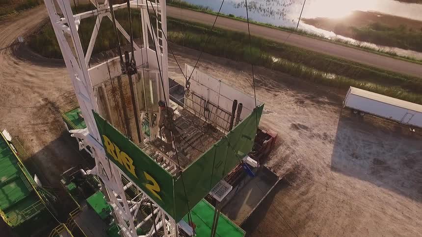 A man works a machine on a work site
