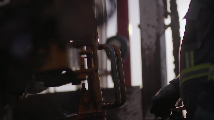 Workers use heavy machinery on the job