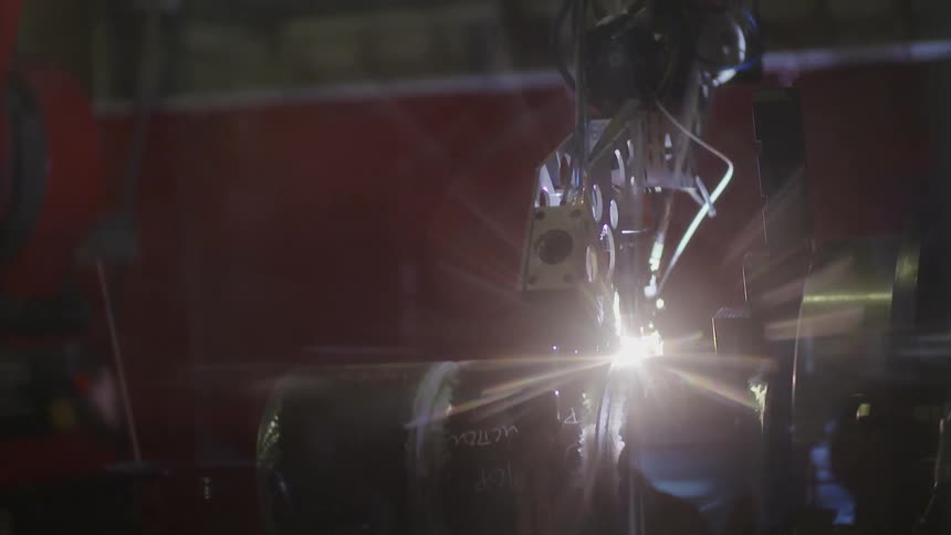 A piece of machinery operates in a factory setting
