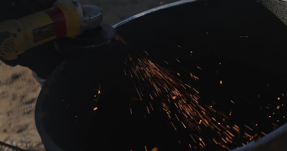 Sparks fly from a grinding power tool
