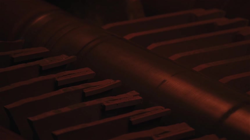 A roller in a machine moves in the dark