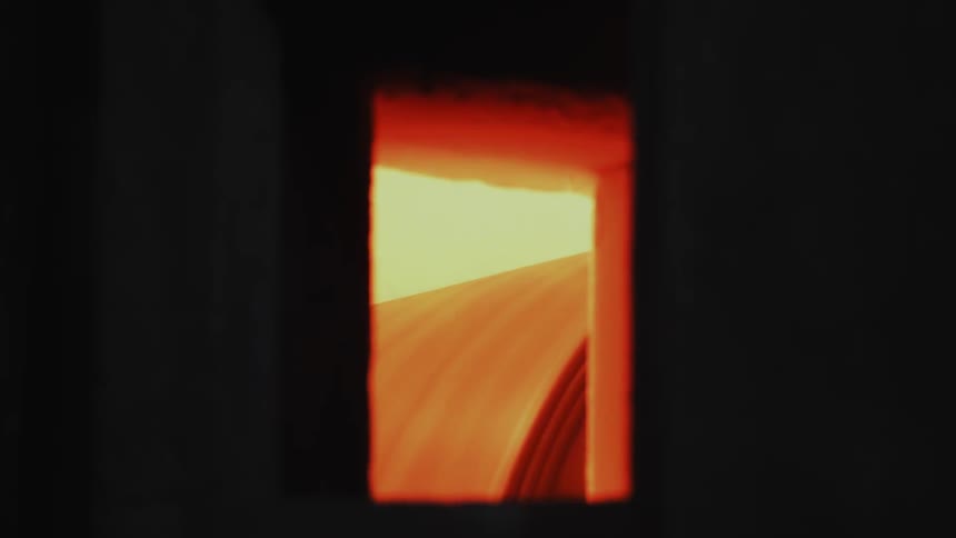 A roller is moving sheets through this window