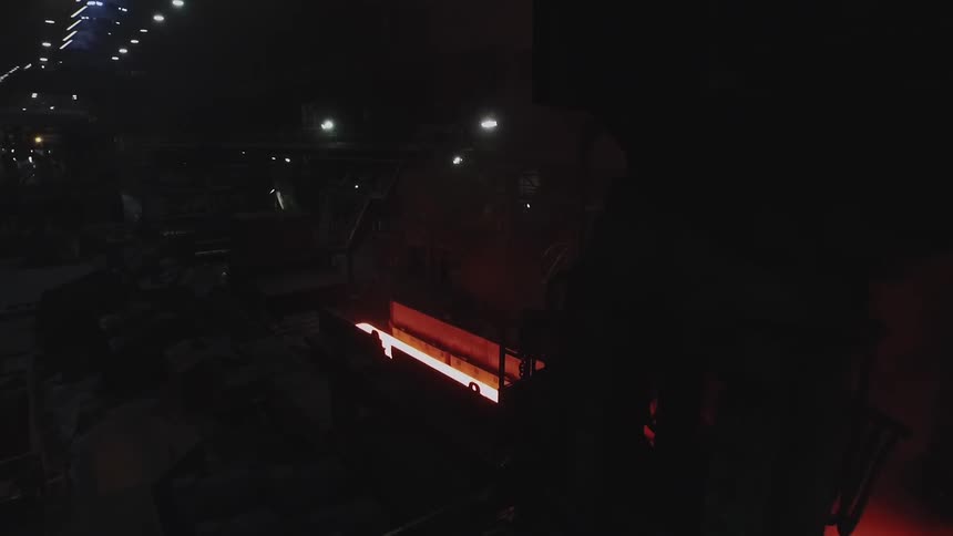 Molten looking sheet rolling on a conveyor belt