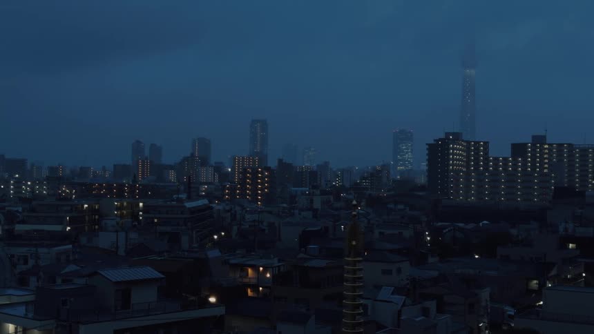 A powerful lightning strike illuminates the Tokyo city skyline and Skytree tower during a dramatic nighttime thunderstorm