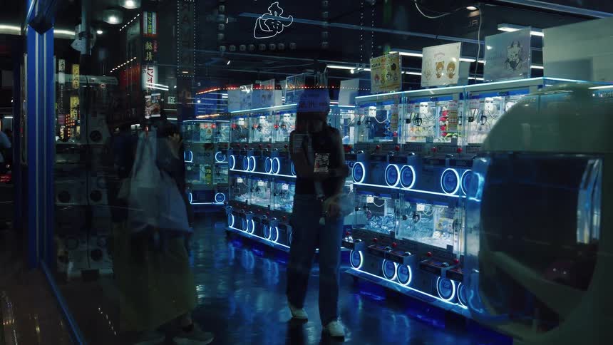 A view from the street through a reflective window into a futuristic Japanese Gachapon store with blue neon lights