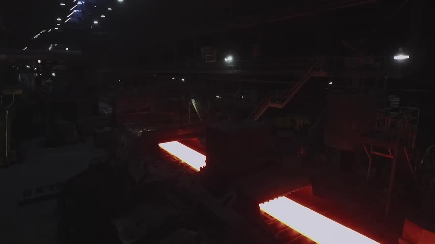 Molten looking sheet rolling on a conveyor belt