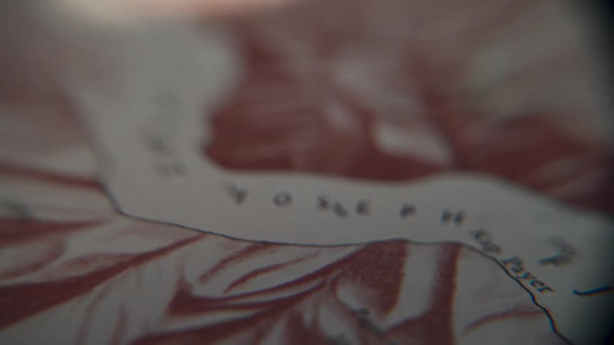 A slow pan reveals the intricate details of a vintage arctic exploration map