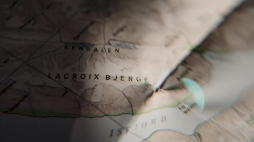 An explorer uses a magnifying glass to meticulously scan an old, weathered map, planning their next great adventure