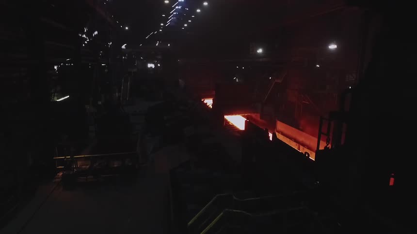 The machine is working with the conveyor belt moving