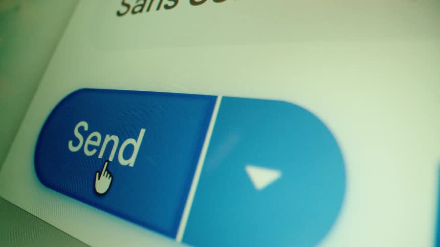 Extreme close-up of a computer cursor clicking the blue 'Send' button on a digital user interface