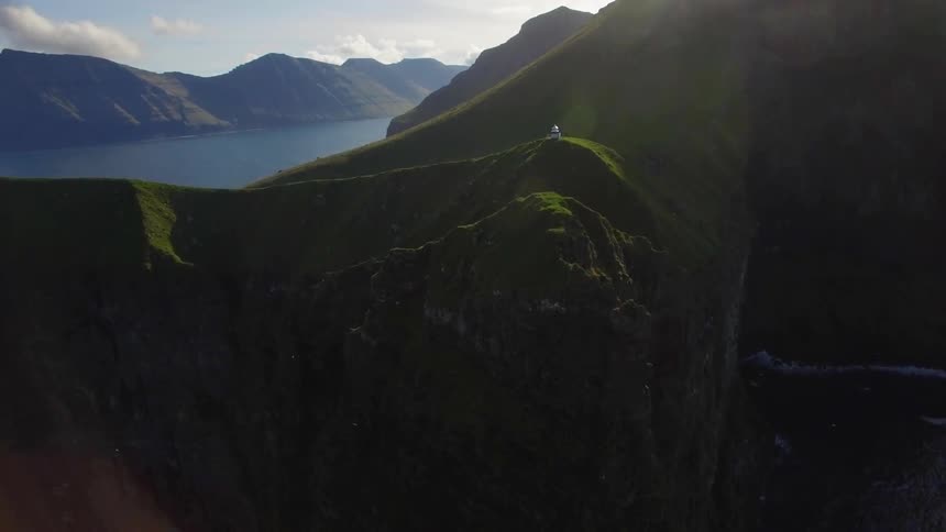 The tall hills are completely covered with green