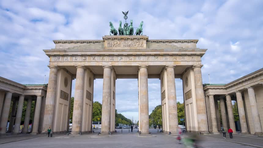 A motion time-lapse capturing the bustling city life around the iconic Brandenburg Gate in Berlin, Germany