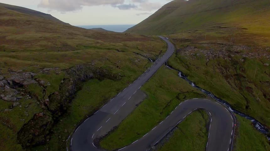 A road winds up a mountainside