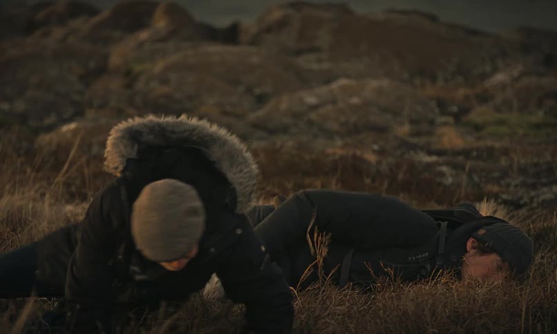 A brutal fight between two men in a remote, cold wilderness ends with one leaving the other beaten and exhausted on the ground