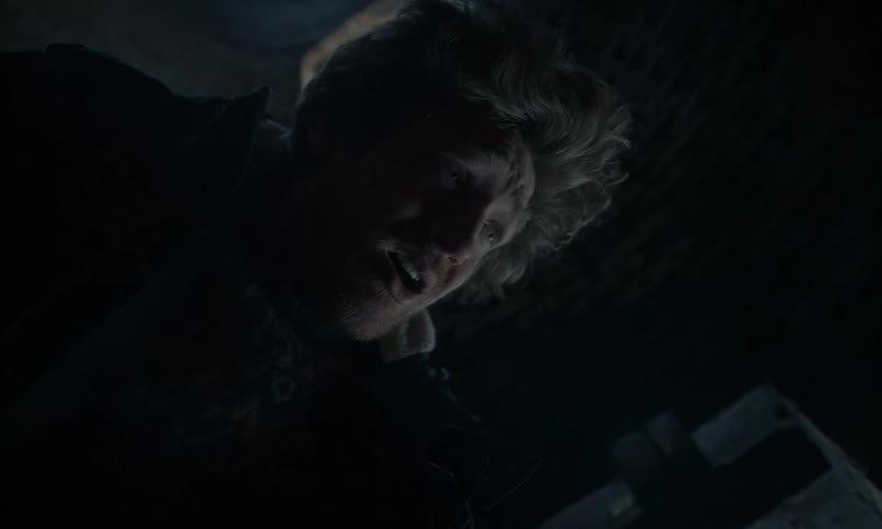 A desperate man trapped at the bottom of a dark well looks up towards the light with a look of hopelessness