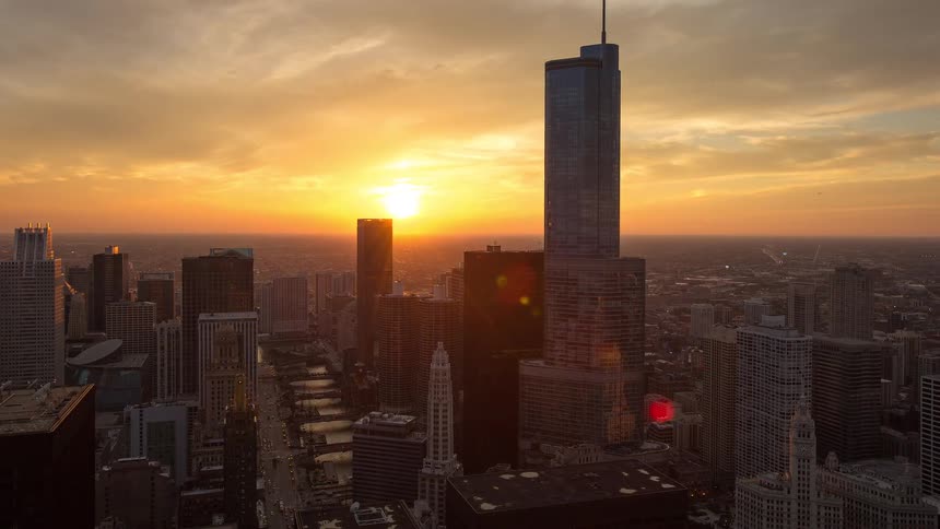 Chicago city skyline glows during a beautiful sunset time-lapse