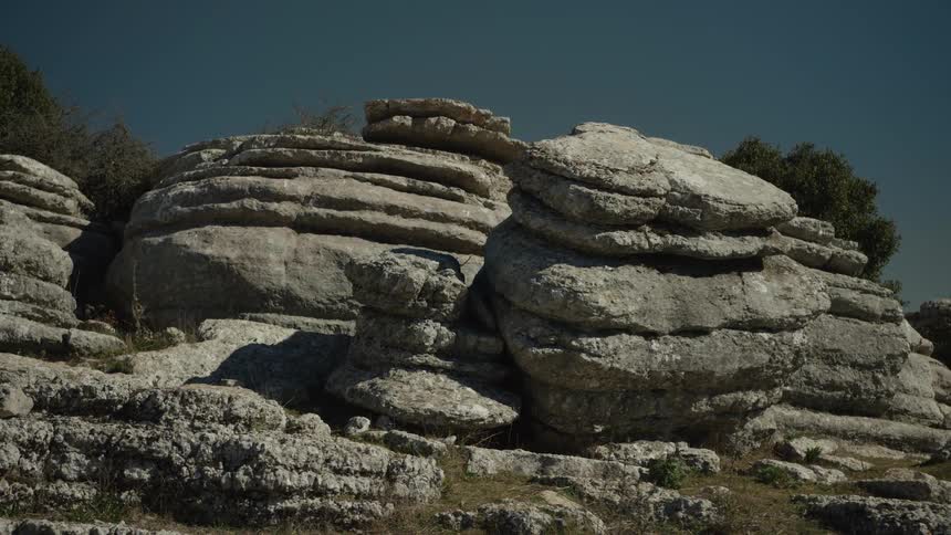A time-lapse of shadows moving across the uniquely layered karst rock formations of El Torcal, Spain on a sunny day
