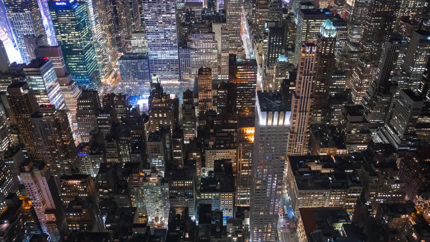An amazing timelapse captures the vibrant energy of New York City from a high-angle perspective as traffic streams through the brightly lit streets at night