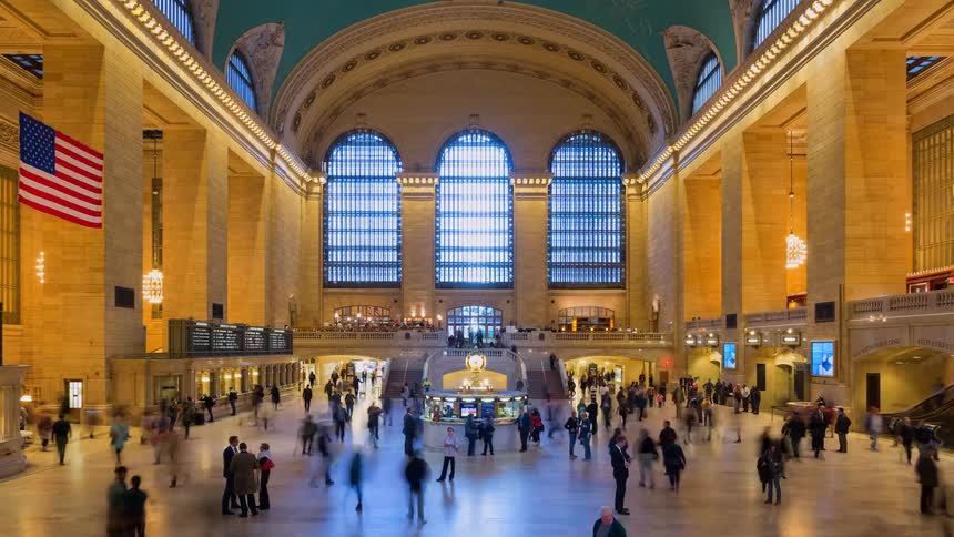 Time-lapse of a bustling crowd of commuters and travelers moving through the iconic Grand Central Terminal in New York City