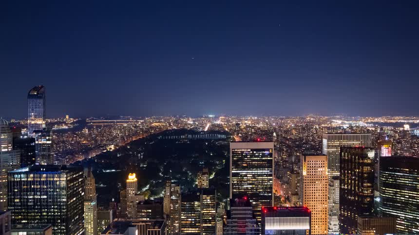 A stunning nighttime timelapse from a skyscraper overlooking Central Park and the expansive New York City skyline as stars streak across the sky