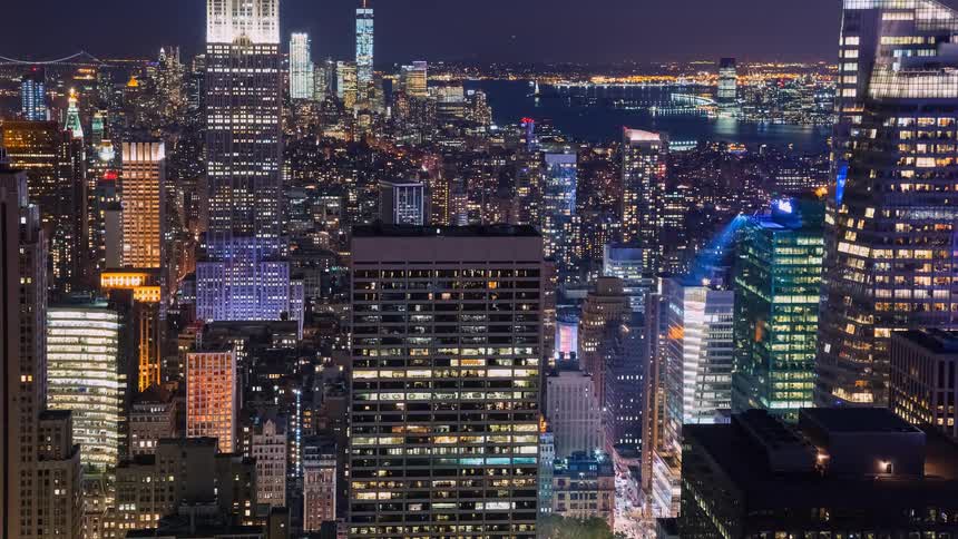 A stunning night-time time-lapse shows the glowing skyscrapers and bustling traffic of the New York City skyline