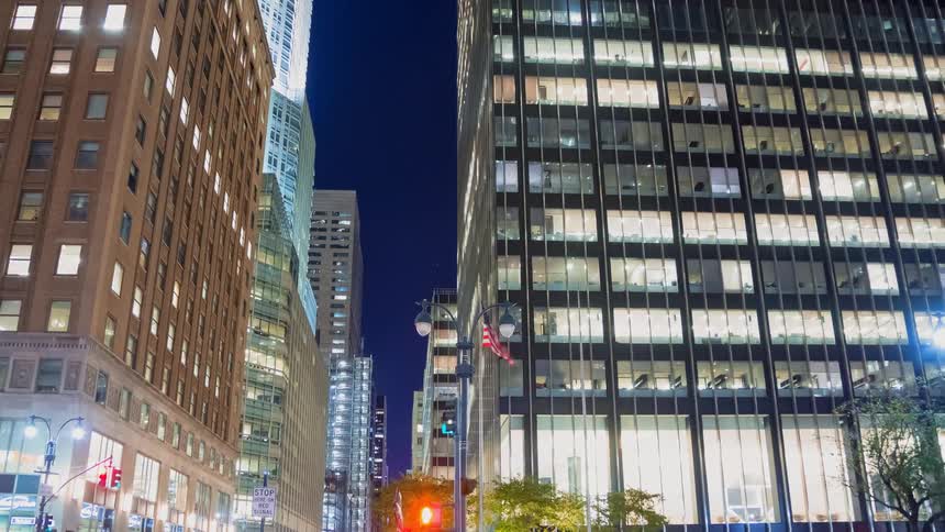 Dynamic night timelapse of Park Avenue in New York City, showing impressive architecture and flowing traffic from a low-angle perspective