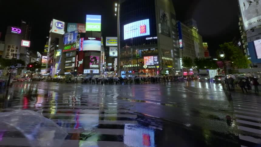 A rainy night timelapse of crowds and umbrellas in Tokyo