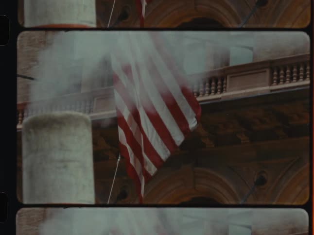 Vintage-style split-screen footage shows a New York City subway sign at night and an American flag waving through street steam
