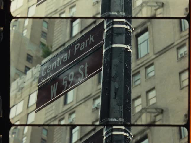 Split screen film shot of pigeons on a lamp post and a Central Park South street sign in New York City