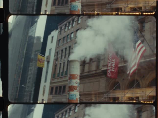 Vintage split screen film footage shows steam rising from a pipe in front of Carnegie Hall in New York City