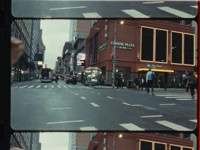 A gritty, vintage film-style montage capturing the daily hustle of New York City streets, from feeding pigeons to yellow cabs in traffic