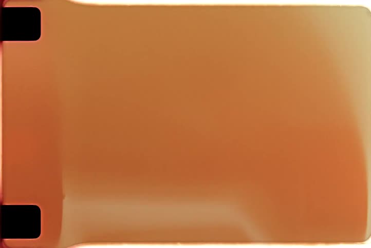Vintage Super 8mm film leader with authentic light leaks, sprocket holes, and warm color burns
