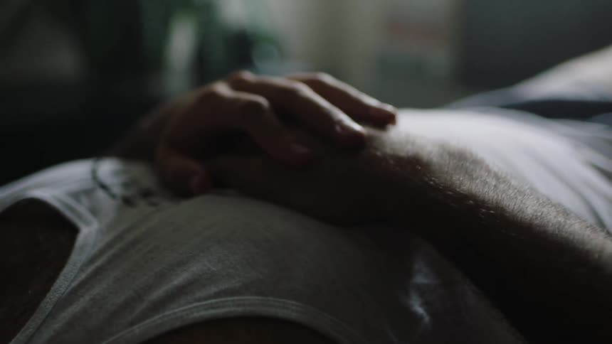 Person laying down tapping a finger on their arm