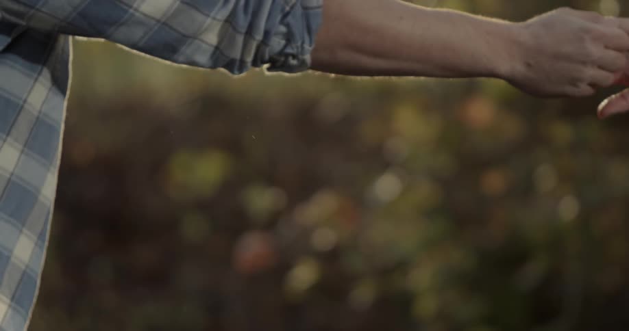 Man and woman dance outside in the woods