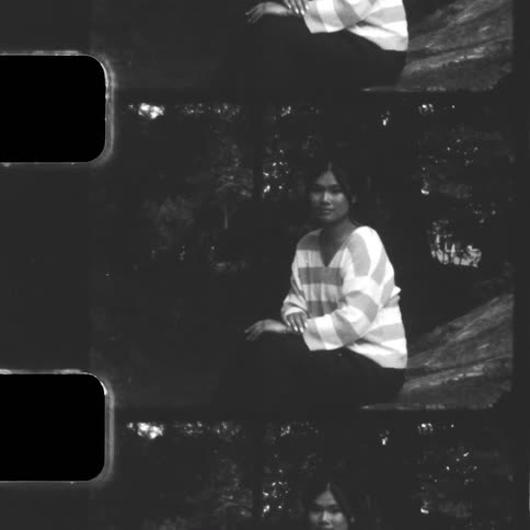 A grainy, black and white, split-screen portrait of a young woman looking at the camera with a vintage film look
