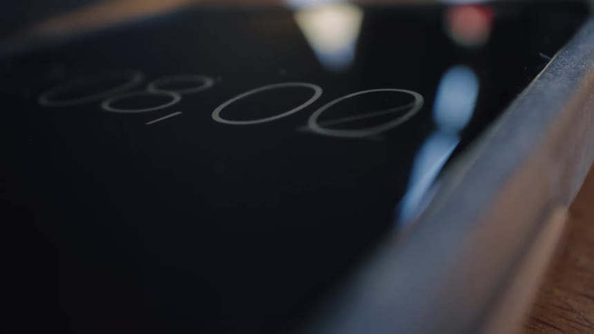 A close-up of a digital stopwatch counting up seconds and milliseconds on a smartphone screen