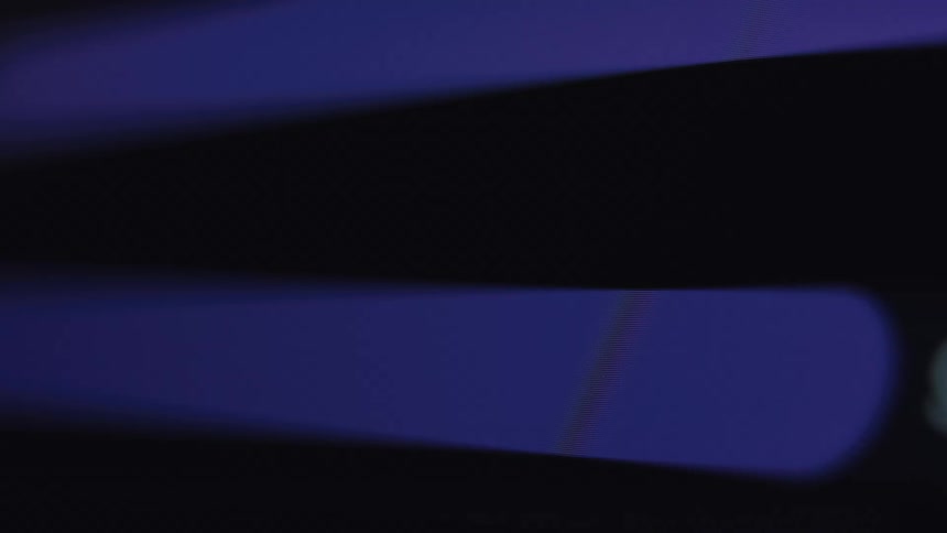 A macro close-up of a digital progress bar loading with percentages on a dark screen