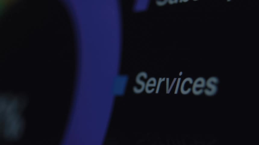 A close-up shot of the word 'Services' coming into focus on a dark digital user interface screen