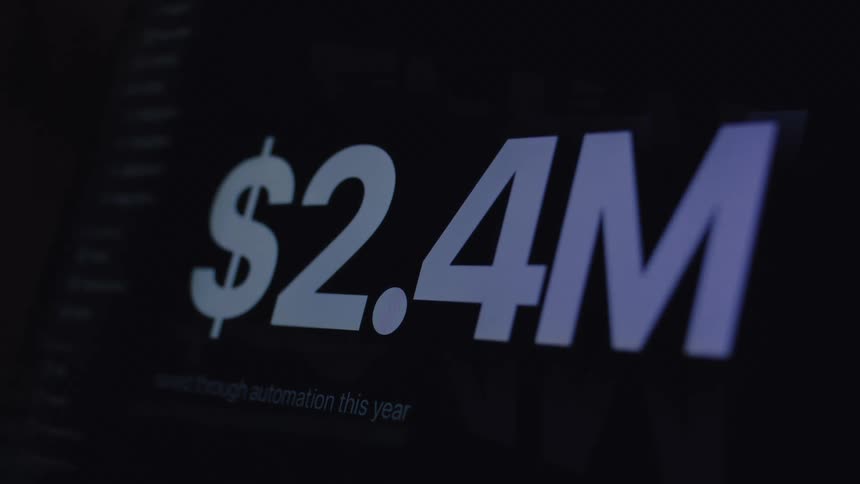A close-up of a digital counter on a screen rapidly increasing to over two million dollars, representing financial growth or savings