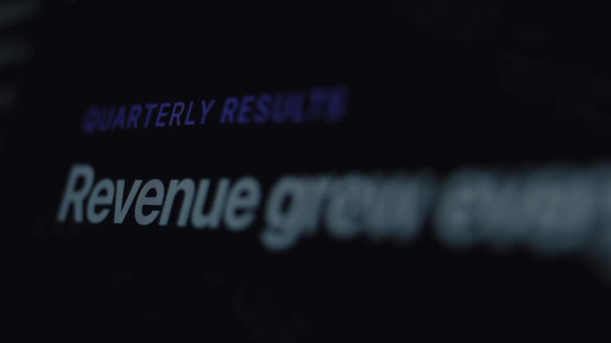A close-up of a digital screen showing a company's quarterly results report with a focus on revenue growth