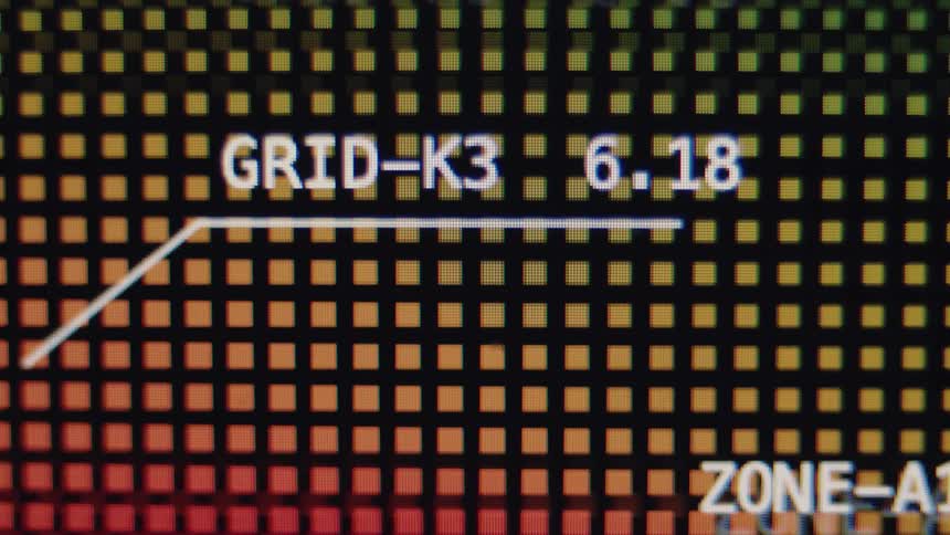 A close-up of a futuristic digital display showing a rising data point on a colorful, pixelated grid